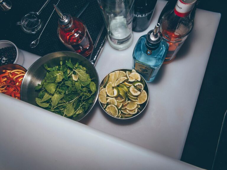 sliced limes on round stainless steel bowl