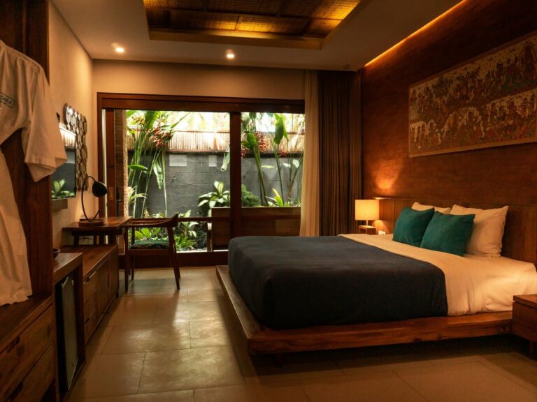 black and white bed near brown wooden table