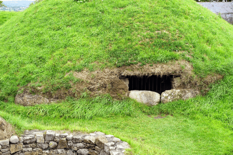 Ancient Irish tomb at Dowth neolithic site entrance, overgrown.